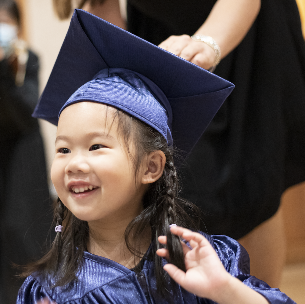 a five year old girl graduating from virtuosos at renaissance kids